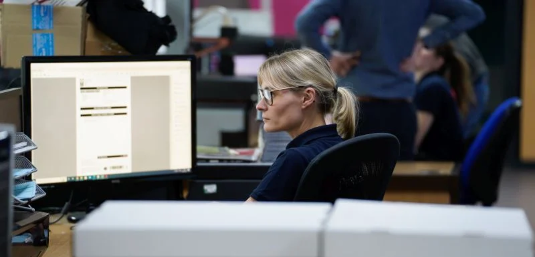woman in front of a computer screen