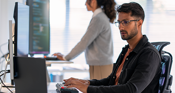 a man looking at a computer